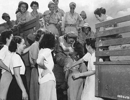 Arriving U.S. Army Nurses are excitedly welcomed by nurses that had been internees at Santo Tomas for the past 3 years, Manila, Philippines, Feb. 1945