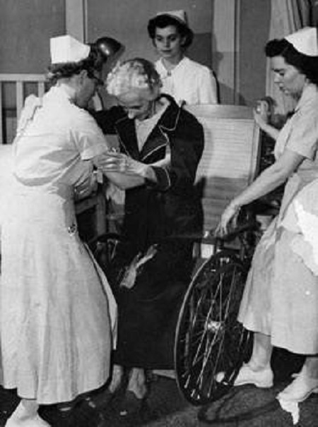 Vanderbilt nursing students aiding an elderly patient during hospital clinicals
