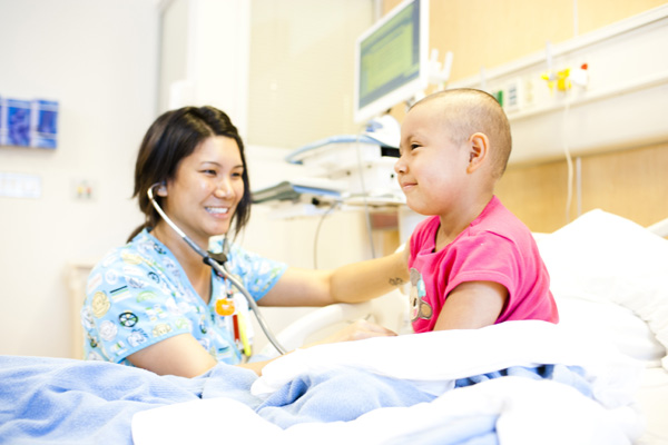 child cancer patient with nurse